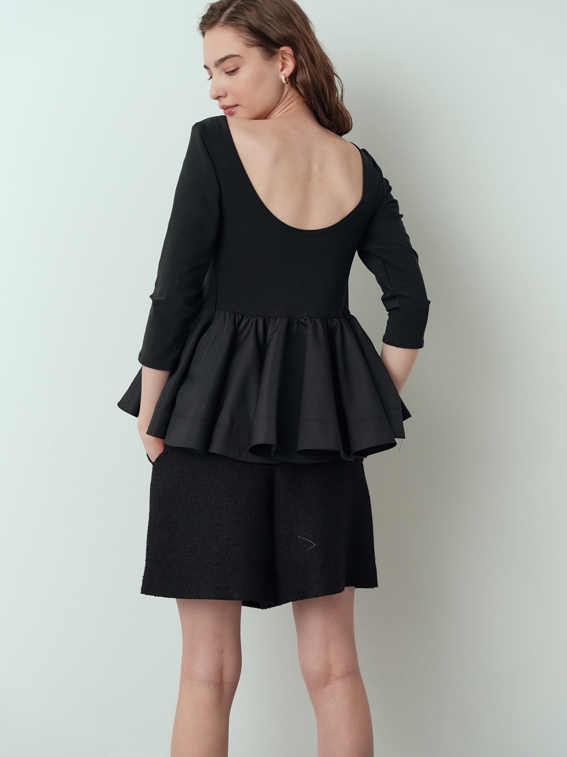 Back-conscious peplum top Charlotte